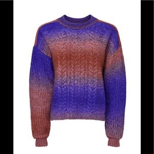 Colorful ombré stripes and braided cable sweater